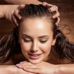 Herbal oils and massage tools for scalp massage treatment at Dhanwantari Ayurvedic Detox Center, promoting hair growth and scalp wellness.