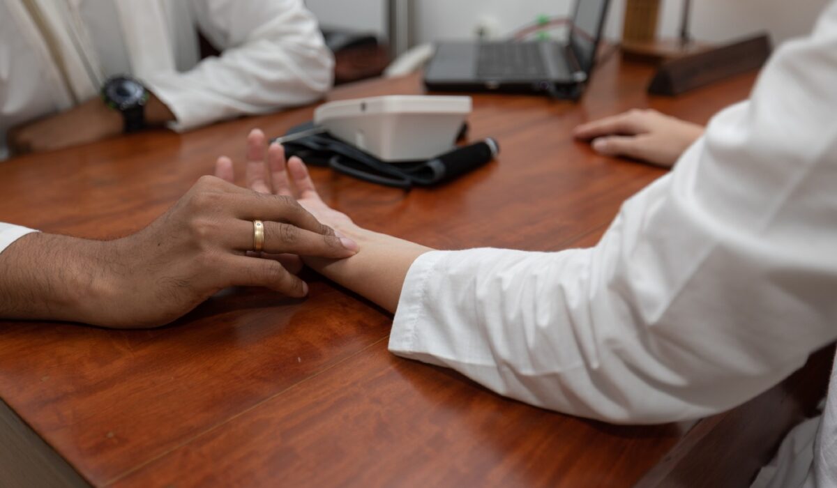 Ayurvedic pulse diagnosis at Dhanwantari Ayurvedic Detox Center to determine your dominant dosha for personalized wellness treatment.